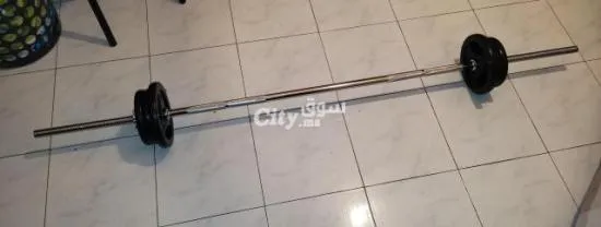 Barre de musculation + 6 disques + 2 stop disques